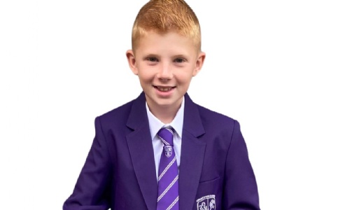 Pupil in purple school uniform 