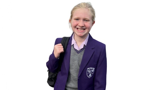 pupil in a purple school uniform